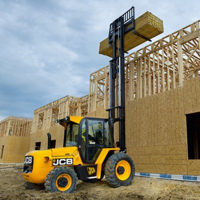Forklift unloading machinery and industrial equipment in Edmonton